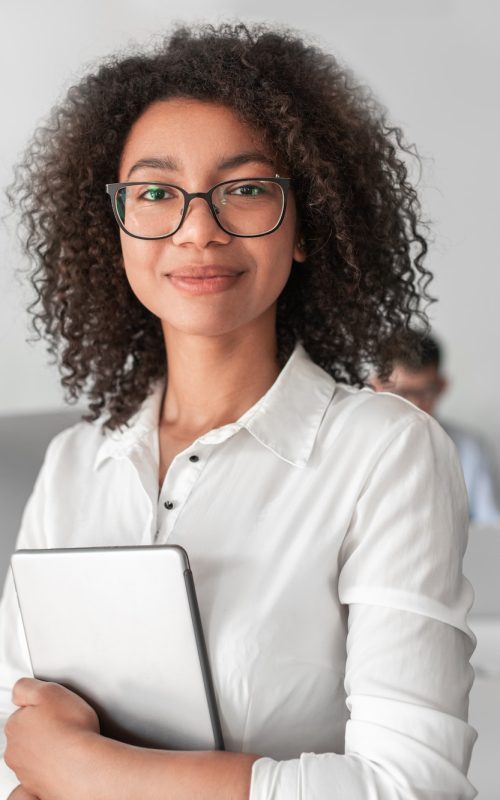 smiling-ethnic-female-recruiter-with-tablet-looking-at-camera-in-office-q4vhgqacu4i13dngzcueluh62qkz7m2h1zi3993dj4